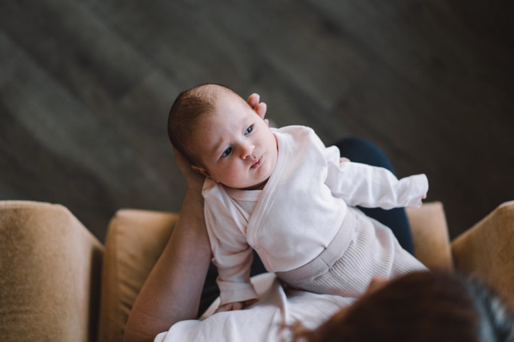 portrait-of-happy-mum-holding-infant-child-on-hand-2023-11-27-04-51-14-utc-min